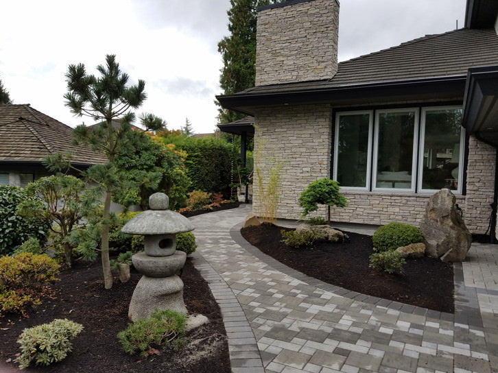 Rain chain called “Tama” made by SEO Inc. is installed on a home with Japanese garden in Canada.